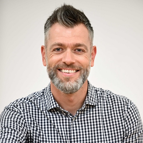 Neil Brown smiling to camera