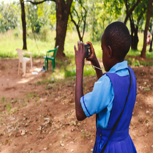 Image of school pupil taking a photograph of environment Image of school pupil taking a photograph of environment