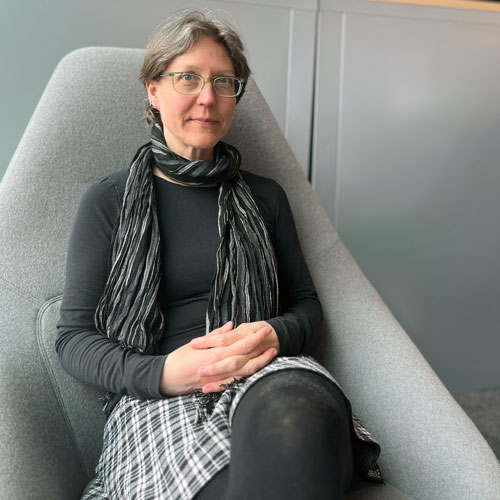 Tanja Mueller sits in a chair, smiling at the camera Tanja Mueller sits in a chair, smiling at the camera