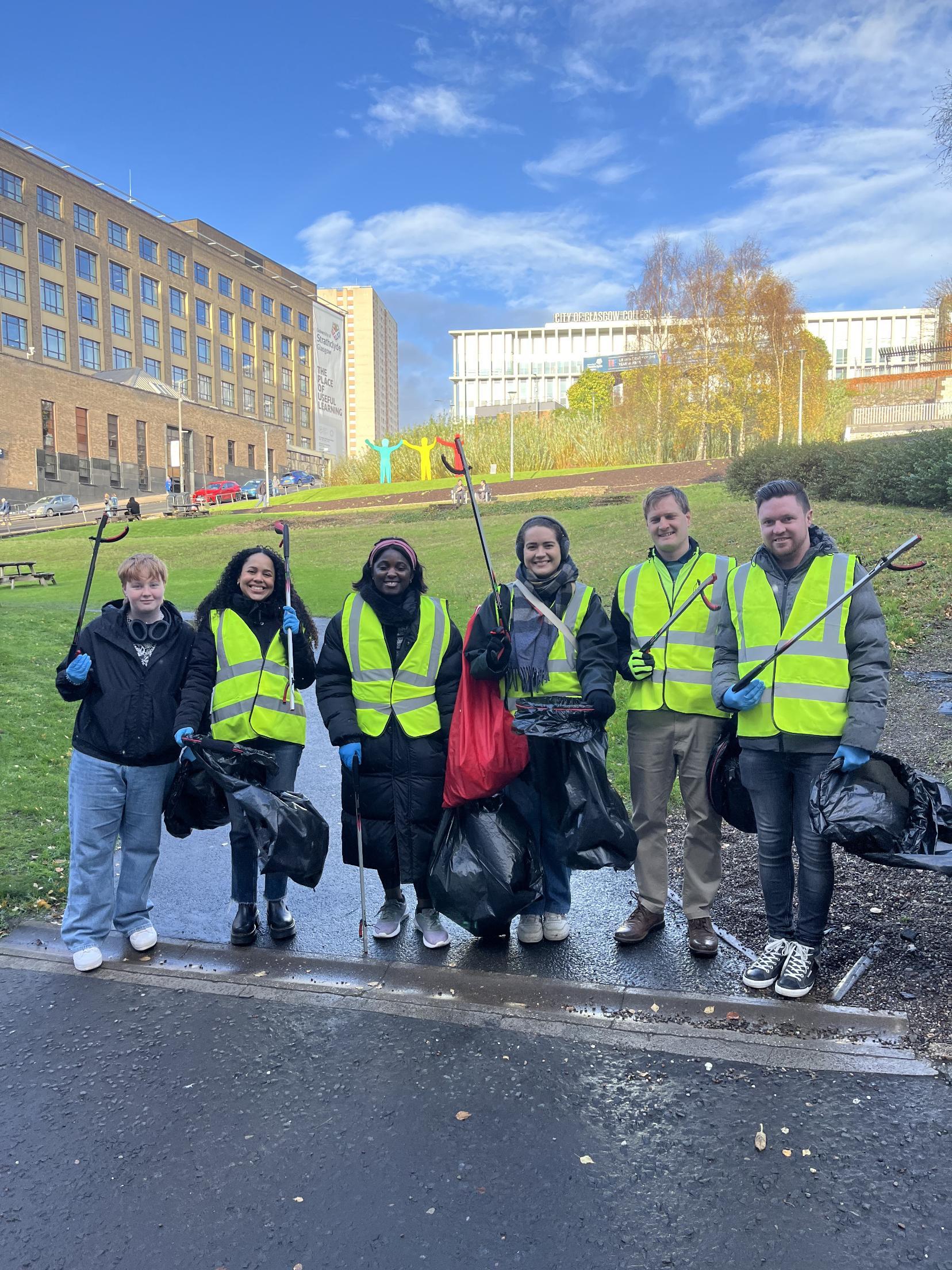 students and staff cleaning the University